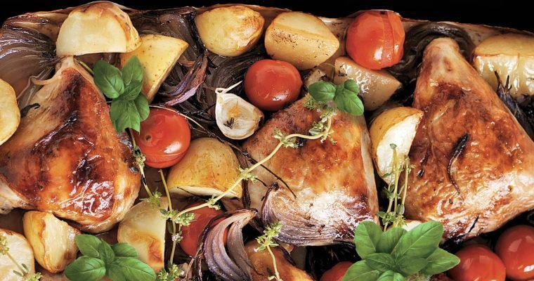 Baked chicken thighs with tomatoes and red onions